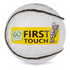 A white sliotar with black stitching and the 'First Touch' logo, designed for young children.